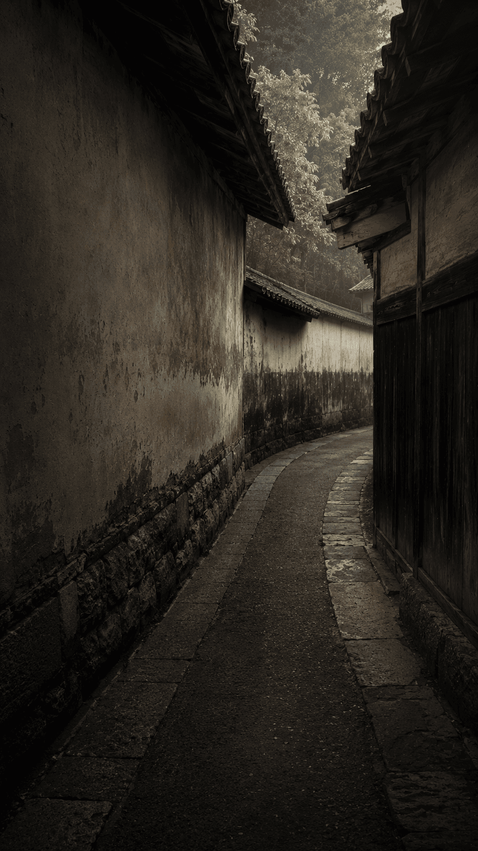 A narrow path between old earthen walls